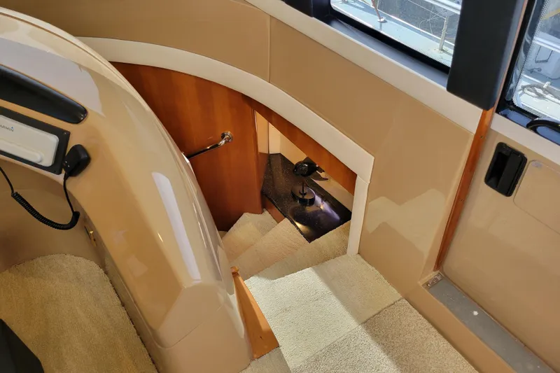  Yacht Photos Pics Interior view of 2001 Carver 570 Voyager Pilothouse, featuring stairs and elegant design.