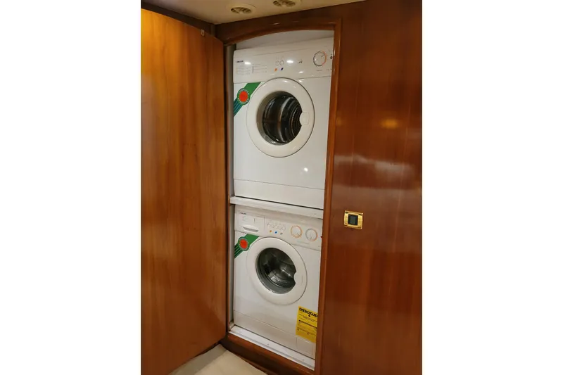  Yacht Photos Pics Stacked washer and dryer in 2001 Carver 570 Voyager Pilothouse yacht interior.