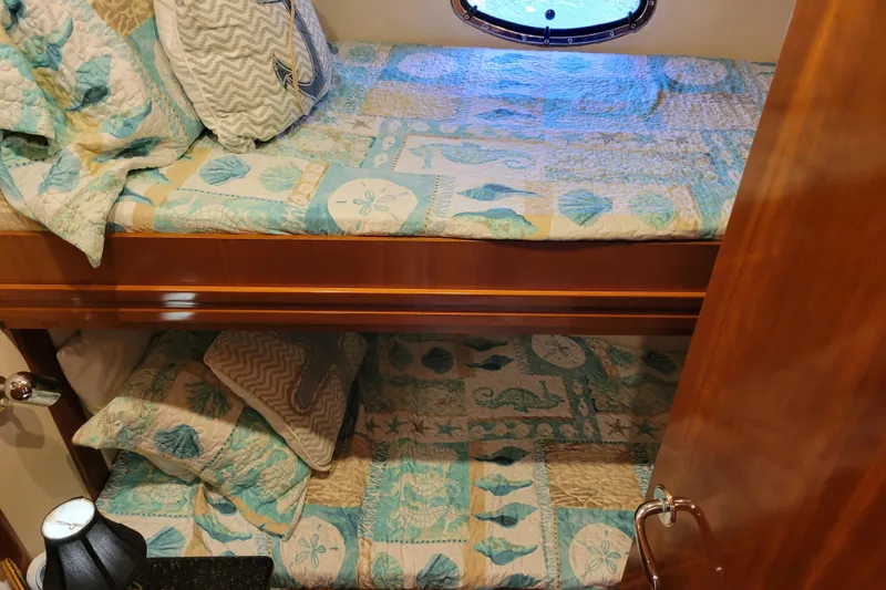  Yacht Photos Pics Bunk beds with nautical-themed bedding in a 2001 Carver 570 Voyager Pilothouse.