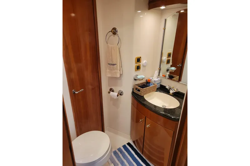  Yacht Photos Pics Luxurious bathroom in 2001 Carver 570 Voyager Pilothouse yacht with elegant fixtures.