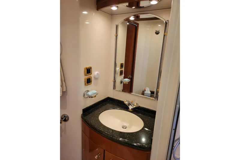  Yacht Photos Pics Luxurious bathroom in 2001 Carver 570 Voyager Pilothouse with elegant sink and mirror.
