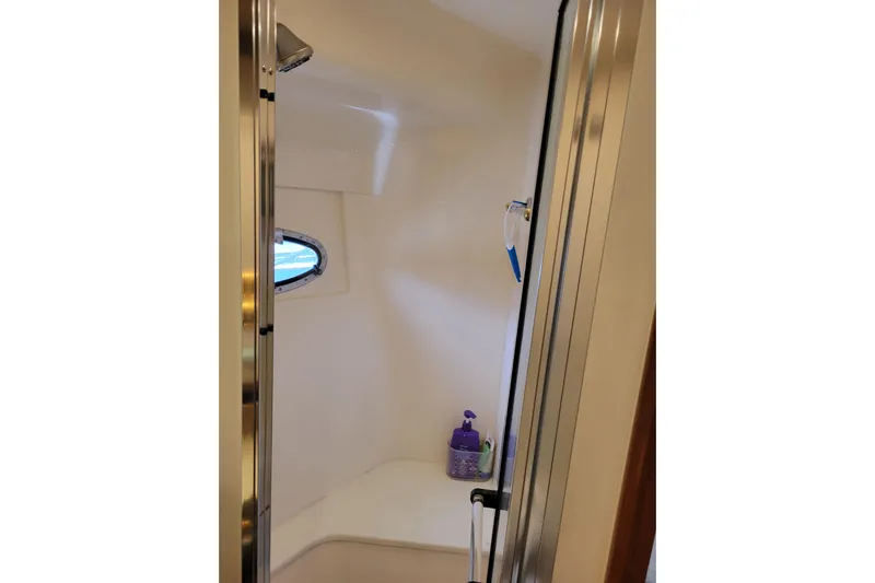  Yacht Photos Pics Shower area inside 2001 Carver 570 Voyager Pilothouse yacht with window and toiletries.