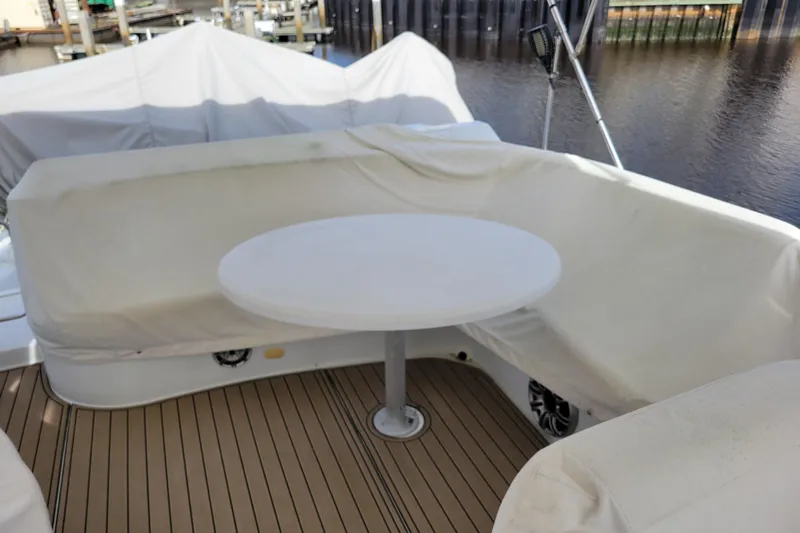  Yacht Photos Pics Covered seating area on 2001 Carver 570 Voyager Pilothouse yacht deck.