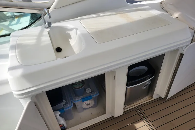  Yacht Photos Pics Outdoor sink and storage on 2001 Carver 570 Voyager Pilothouse yacht deck.