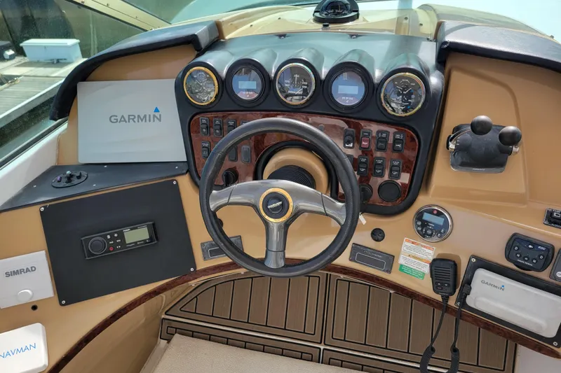  Yacht Photos Pics 2001 Carver 570 Voyager Pilothouse helm with Garmin navigation and control instruments.