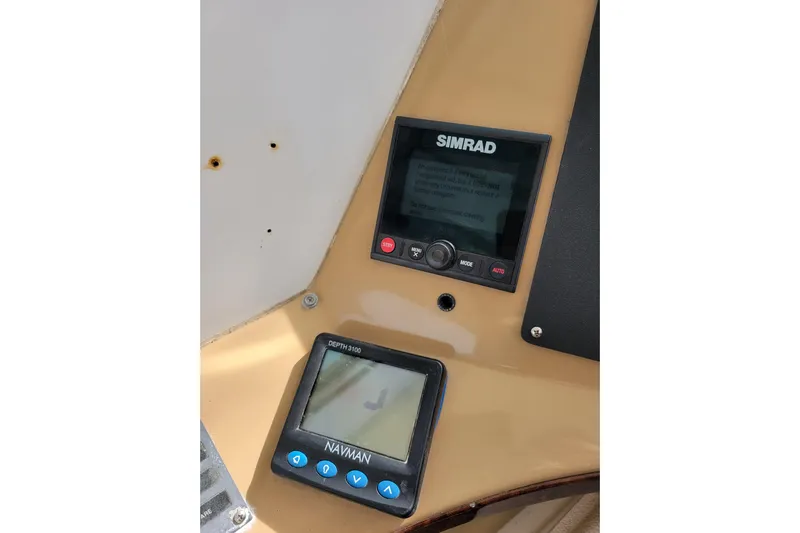  Yacht Photos Pics Simrad and Navman displays on 2001 Carver 570 Voyager Pilothouse dashboard.