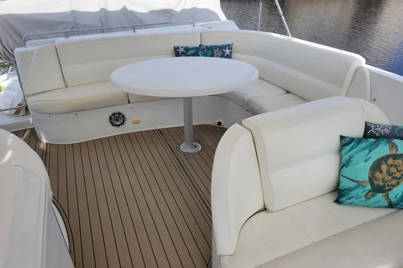  Yacht Photos Pics Luxurious seating area on 2001 Carver 570 Voyager Pilothouse yacht with decorative pillows.
