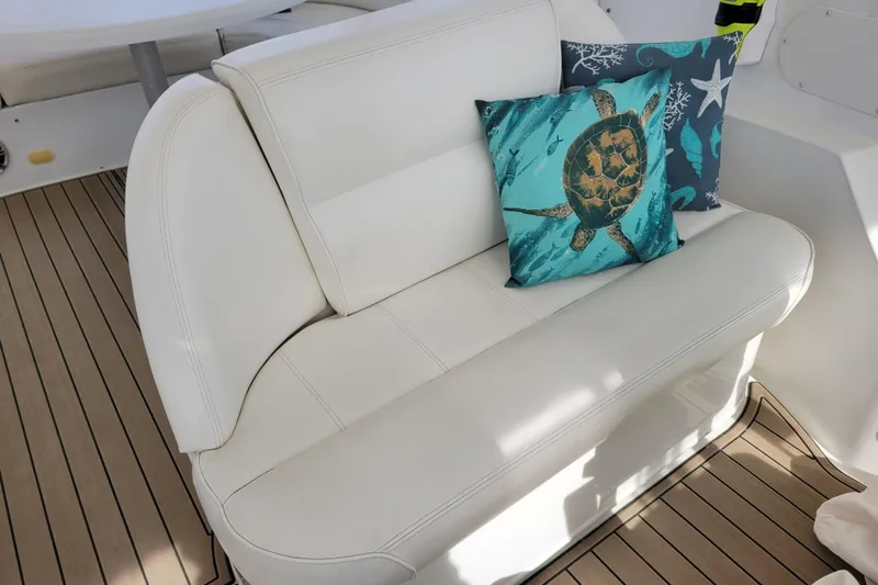  Yacht Photos Pics White leather seating with turtle-themed pillows on 2001 Carver 570 Voyager Pilothouse yacht.