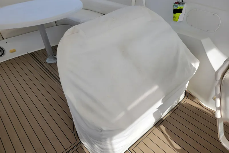  Yacht Photos Pics Covered seating area on 2001 Carver 570 Voyager Pilothouse boat deck.