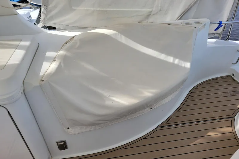  Yacht Photos Pics Covered seating area on 2001 Carver 570 Voyager Pilothouse yacht deck.