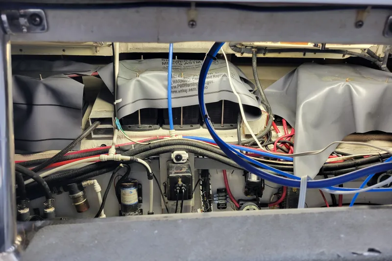  Yacht Photos Pics Engine compartment of a 2001 Carver 570 Voyager Pilothouse with visible wiring and components.