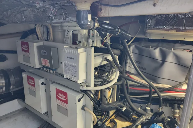  Yacht Photos Pics Engine room of a 2001 Carver 570 Voyager Pilothouse with electrical components and wiring.