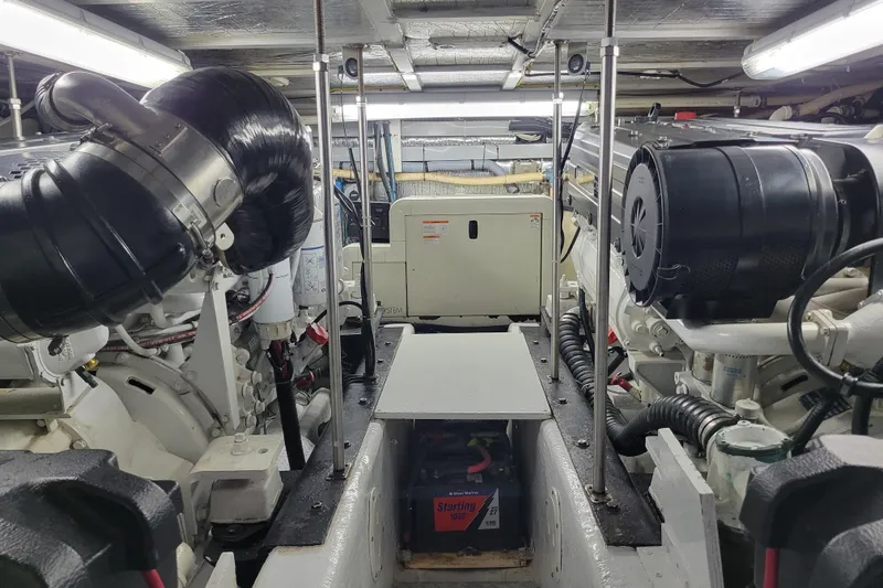  Yacht Photos Pics Engine room of a 2001 Carver 570 Voyager Pilothouse with visible machinery and components.