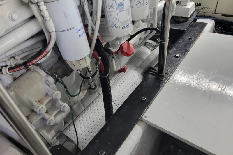  Yacht Photos Pics Engine room of a 2001 Carver 570 Voyager Pilothouse with visible filters and wiring.