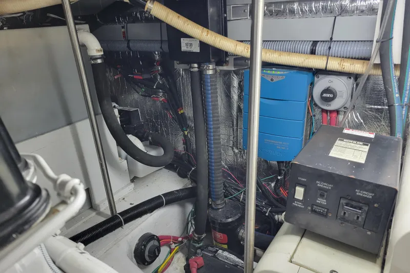  Yacht Photos Pics Engine room of a 2001 Carver 570 Voyager Pilothouse with electrical components and wiring.