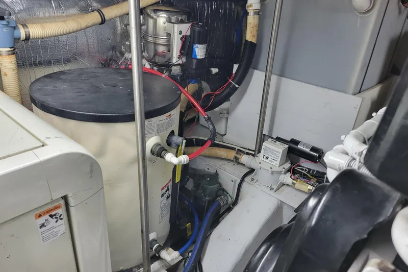  Yacht Photos Pics Engine room of a 2001 Carver 570 Voyager Pilothouse with mechanical components and wiring.