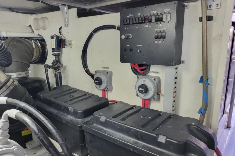  Yacht Photos Pics Engine room of 2001 Carver 570 Voyager Pilothouse with electrical panel and battery boxes.