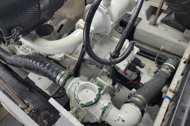  Yacht Photos Pics Engine compartment of a 2001 Carver 570 Voyager Pilothouse with visible hoses and components.