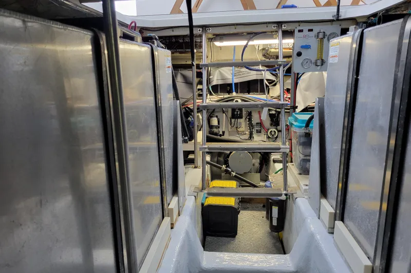  Yacht Photos Pics Engine room of 2001 Carver 570 Voyager Pilothouse with visible machinery and equipment.