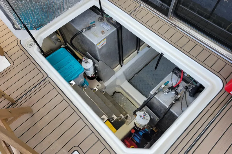  Yacht Photos Pics Engine compartment of a 2001 Carver 570 Voyager Pilothouse yacht, showcasing mechanical components.