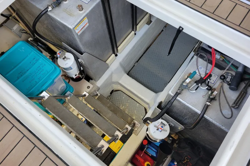  Yacht Photos Pics Engine compartment of a 2001 Carver 570 Voyager Pilothouse with visible equipment and storage.