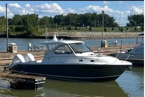  Yacht Photos Pics 2021 Pursuit OS 355 Offshore boat docked in a serene marina setting.