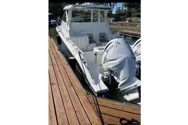 Yacht Photos Pics 2021 Pursuit OS 355 Offshore boat docked with Yamaha outboard engines.
