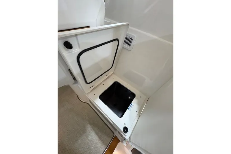  Yacht Photos Pics Open storage compartment on 2021 Pursuit OS 355 Offshore boat interior.