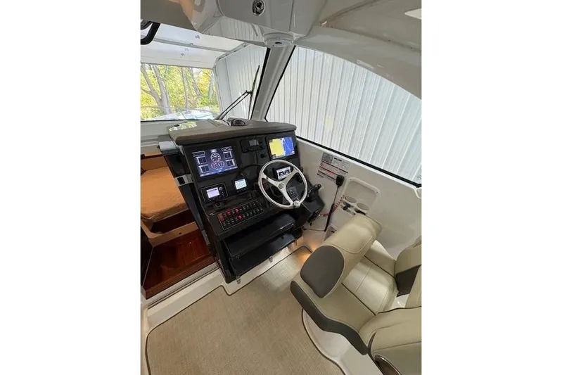  Yacht Photos Pics 2021 Pursuit OS 355 Offshore helm with modern controls and comfortable seating.
