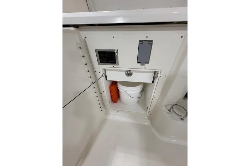  Yacht Photos Pics 2021 Pursuit OS 355 Offshore storage compartment with bucket and equipment.