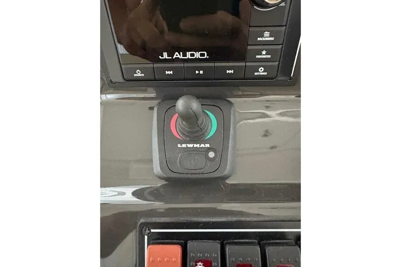  Yacht Photos Pics Control panel of 2021 Pursuit OS 355 Offshore with JL Audio system and Lewmar joystick.