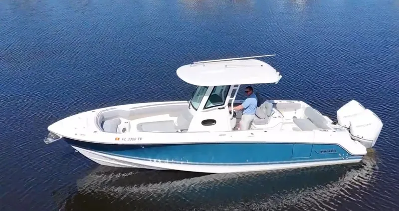  Yacht Photos Pics 2023 Boston Whaler 280 Outrage boat on calm water, side view.