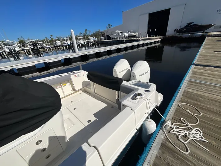  Yacht Photos Pics 2023 Boston Whaler 280 Outrage docked, featuring dual Mercury engines.