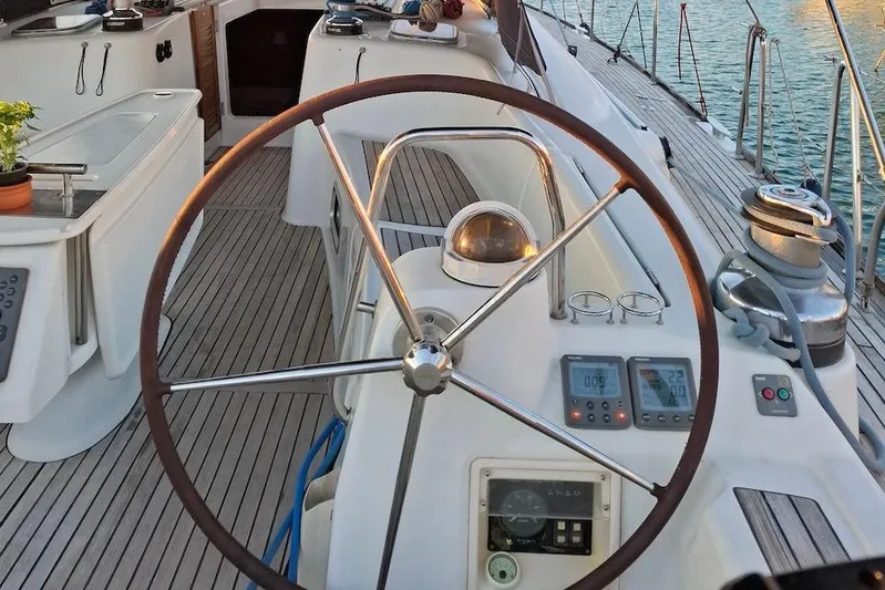  Yacht Photos Pics Steering wheel and controls of a 2009 Beneteau Oceanis 54 sailboat.