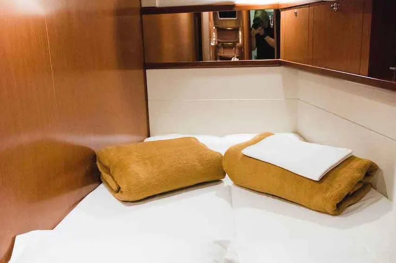  Yacht Photos Pics Cozy cabin interior of 2009 Beneteau Oceanis 54 yacht with warm wooden finishes.