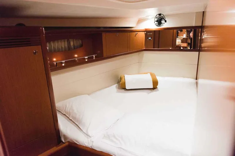  Yacht Photos Pics Luxurious cabin interior of 2009 Beneteau Oceanis 54 yacht with cozy bedding.
