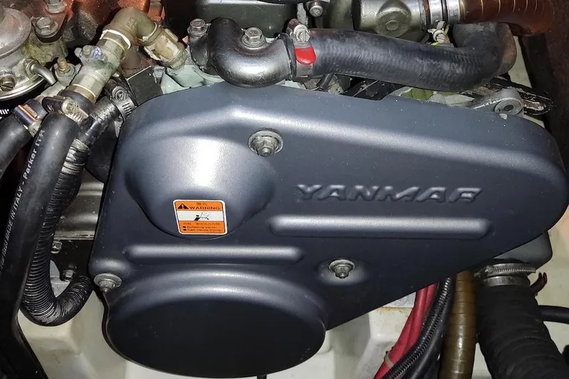  Yacht Photos Pics Yanmar engine in a 2009 Beneteau Oceanis 54 sailboat, showcasing mechanical components.