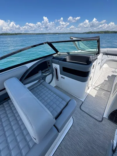 Yacht Photos Pics 2022 Cobalt R30 boat interior with seating, on a clear blue lake.