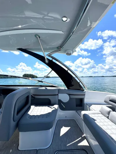  Yacht Photos Pics Luxurious interior of 2022 Cobalt R30 boat with sleek seating and scenic water view.