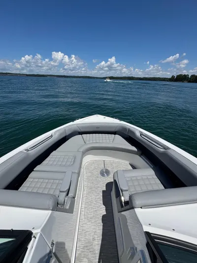  Yacht Photos Pics 2022 Cobalt R30 boat on a sunny lake with clear skies.