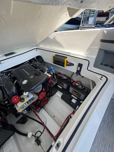  Yacht Photos Pics 2022 Cobalt R30 engine compartment with batteries and wiring, showcasing modern marine engineering.
