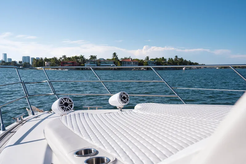  Yacht Photos Pics Luxurious 2005 Azimut 62 Evolution yacht deck with ocean view and coastal scenery.