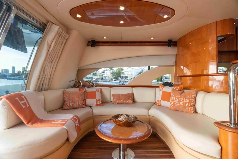  Yacht Photos Pics Luxurious interior of 2005 Azimut 62 Evolution yacht with elegant seating and decor.
