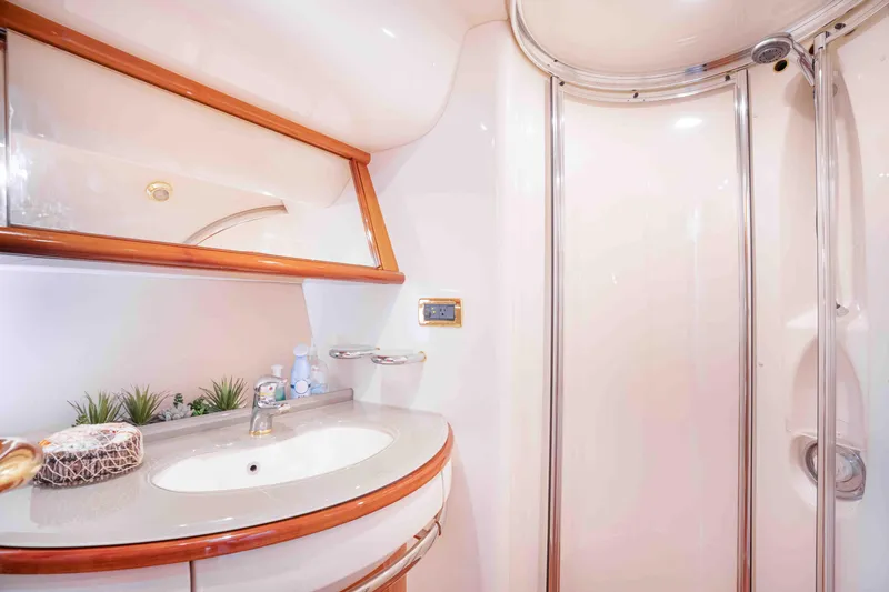  Yacht Photos Pics Luxurious bathroom in 2005 Azimut 62 Evolution yacht with modern fixtures and elegant design.