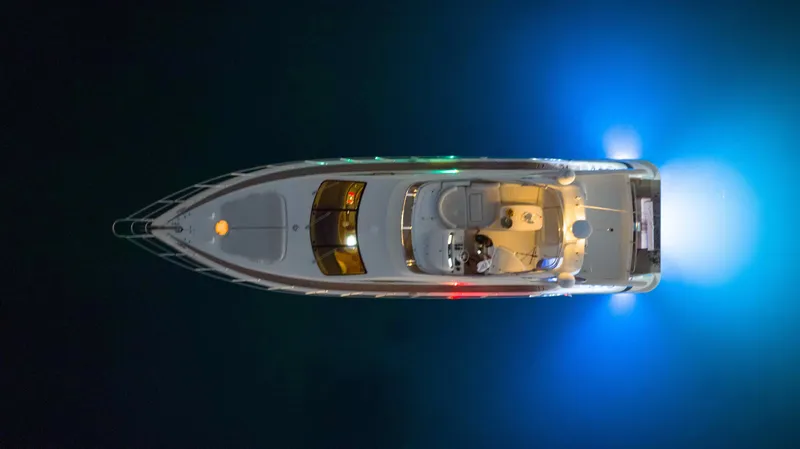  Yacht Photos Pics Aerial view of 2005 Azimut 62 Evolution yacht illuminated at night.
