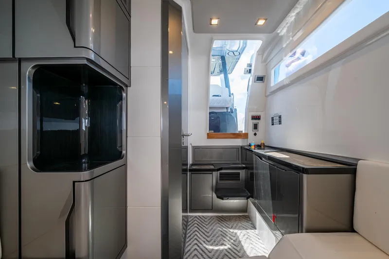 Drei Kinder Yacht Photos Pics Modern interior of 2023 Schaefer V33 yacht with sleek cabinetry and natural light.