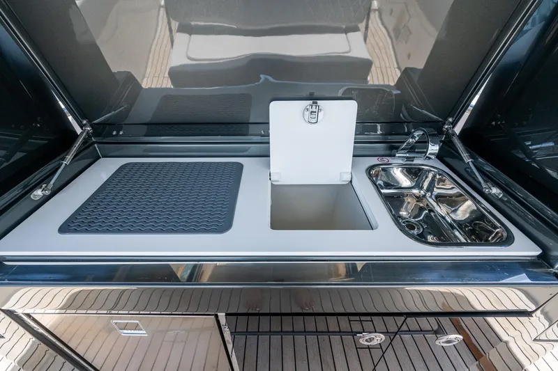 Drei Kinder Yacht Photos Pics 2023 Schaefer V33 yacht kitchen with sink, cutting board, and storage.