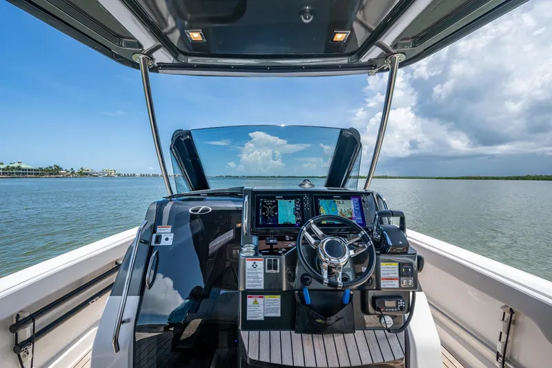 Drei Kinder Yacht Photos Pics 2023 Schaefer V33 boat helm with advanced navigation system on open water.