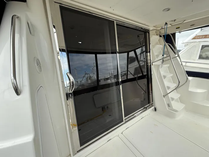 The Office Yacht Photos Pics 2001 Bayliner 5288 Pilot House Motoryacht with sliding glass doors and exterior stairs.