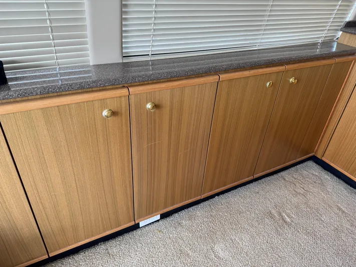 The Office Yacht Photos Pics Wooden cabinets with brass knobs in a 2001 Bayliner 5288 Pilot House Motoryacht.